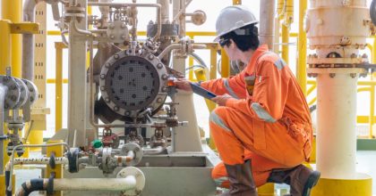 A man standing in front of a truck